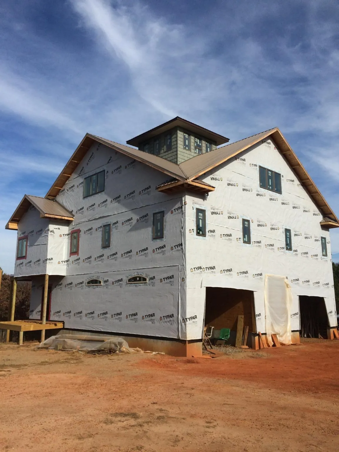 New two story house under construction with a cupola and gabled roofs in Tarawa Terrace